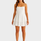 Alice - Mini vestido sin espalda con tirantes con lazo y falda en capas